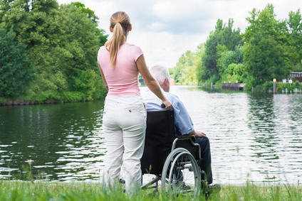 Home Care Agency Michigan pushing man in wheelchair